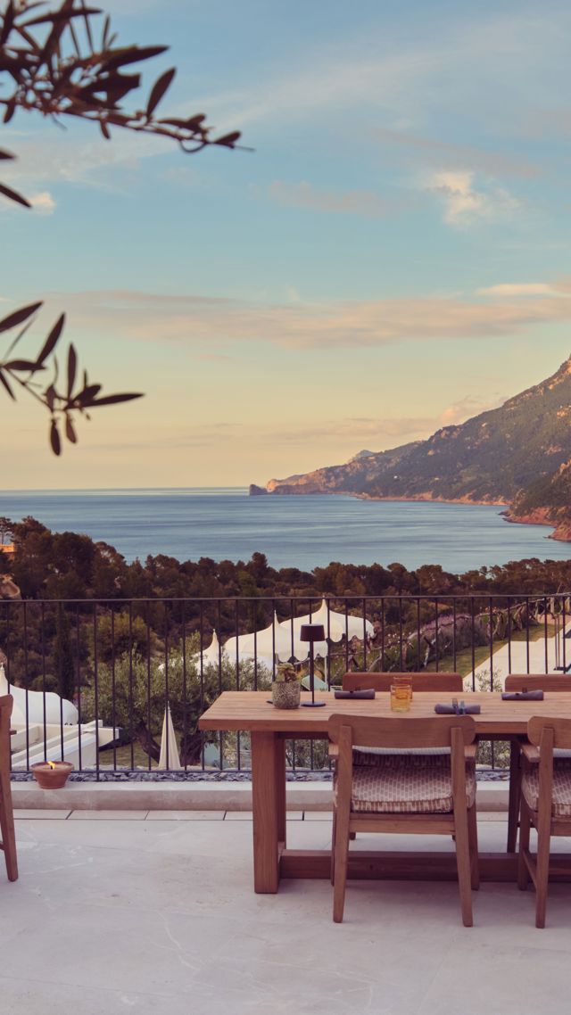 Restaurant terrace at Sa Tafona with sea and mountain views