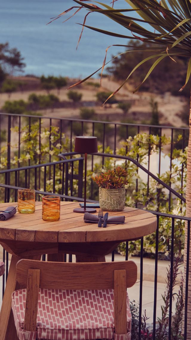 Outdoor terrace at Sa Tafona overlooking sea