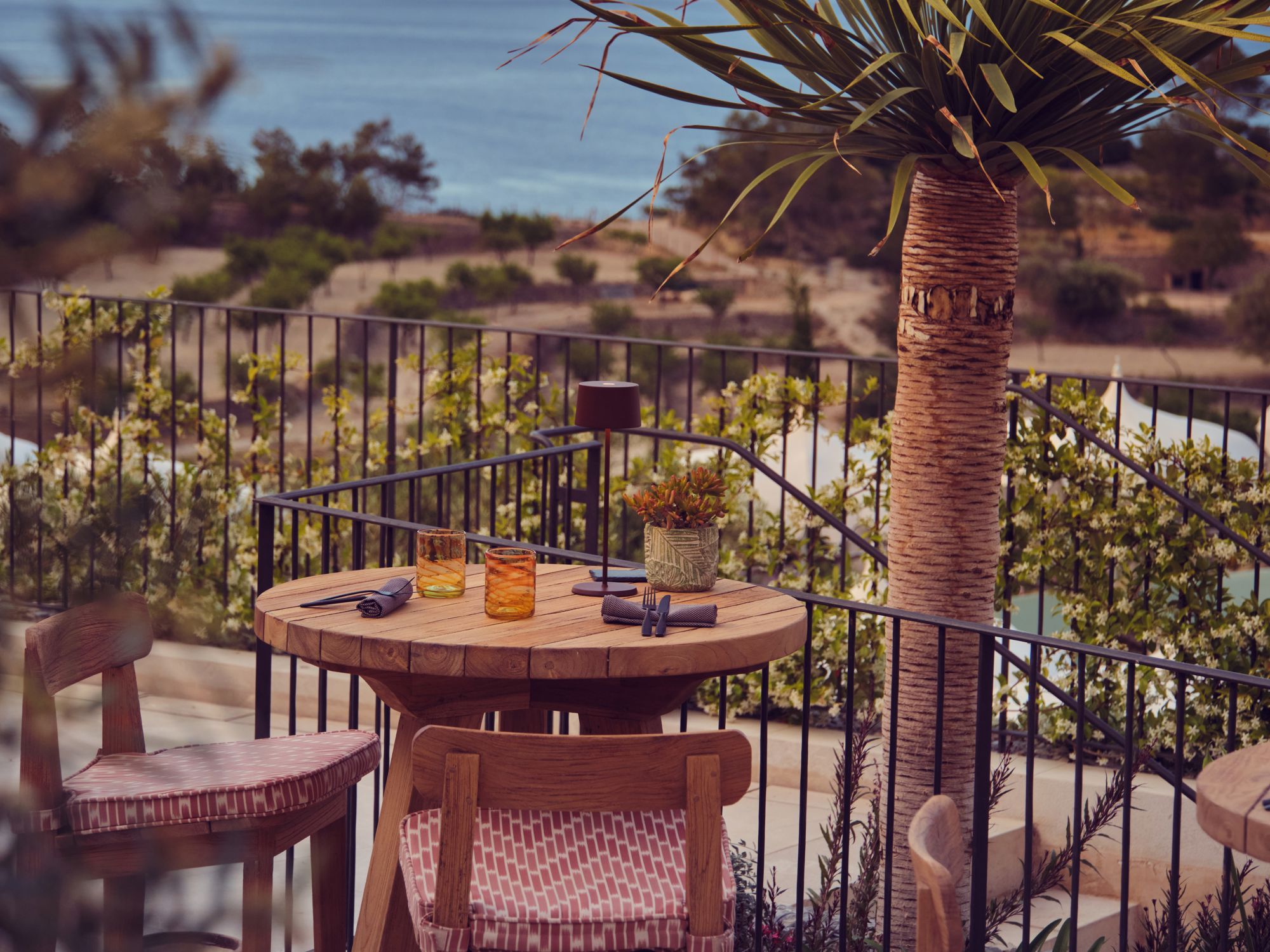 Outdoor terrace at Sa Tafona overlooking sea