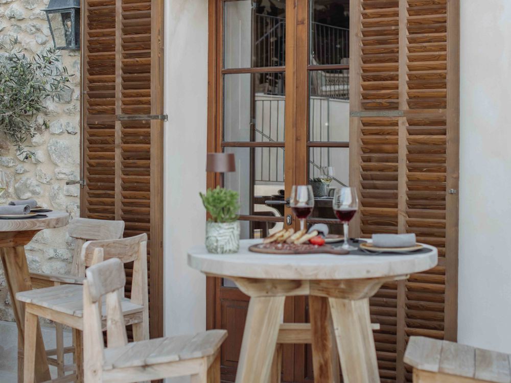 Wooden outdoor table set at Sa Tafona